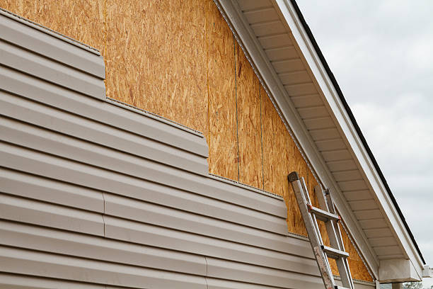 Professional Siding technician working in Winburne, PA